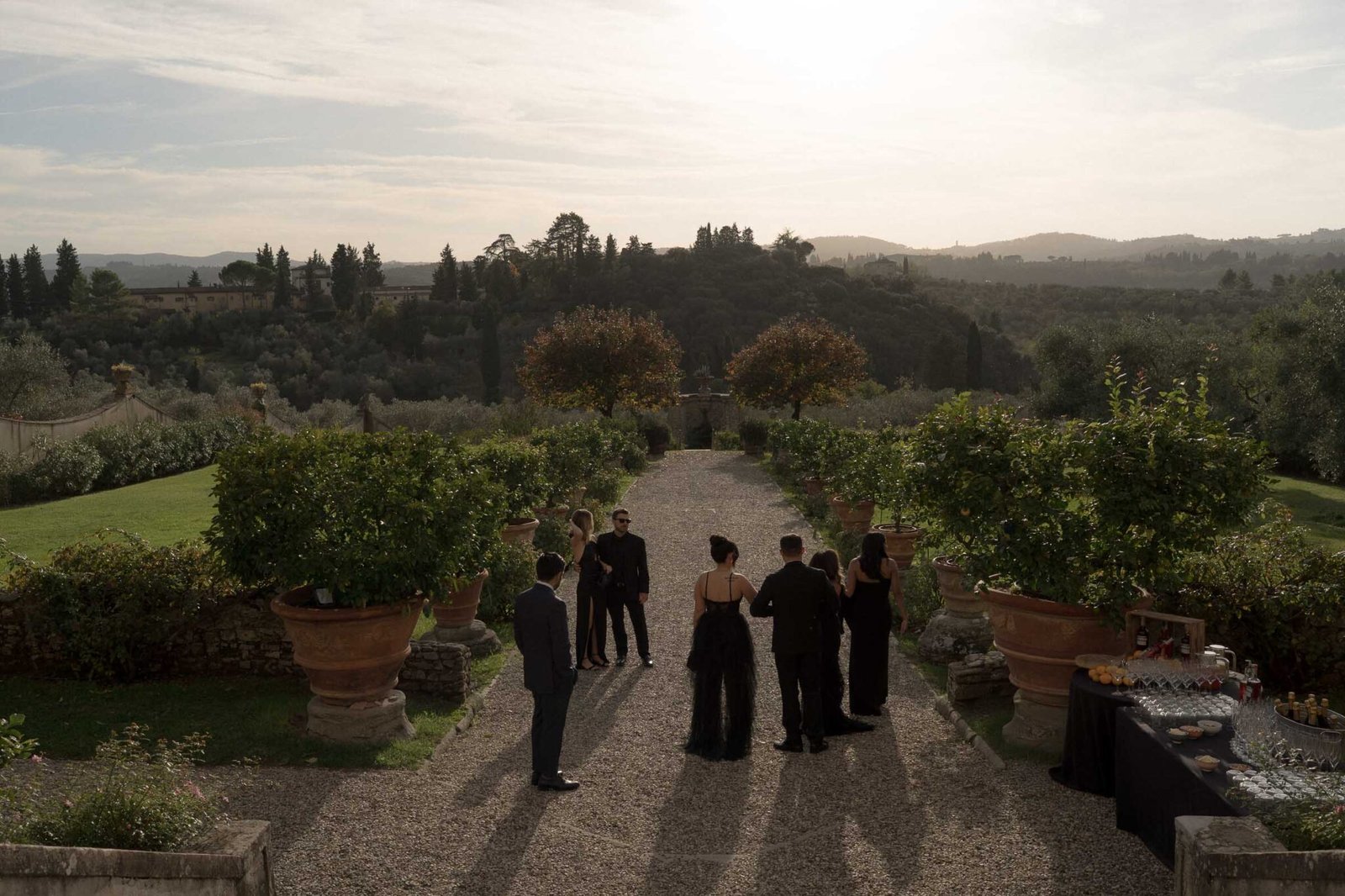 Wedding guests enjoying aperitivo at a Tuscan villa
